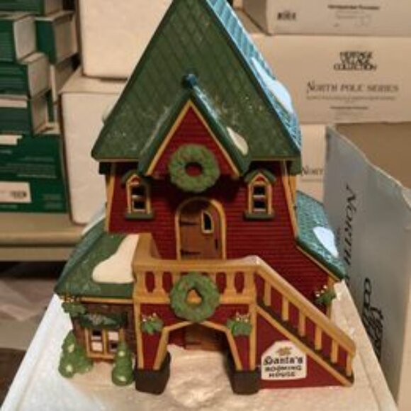 Department 56 N. Pole series Santas rooming house